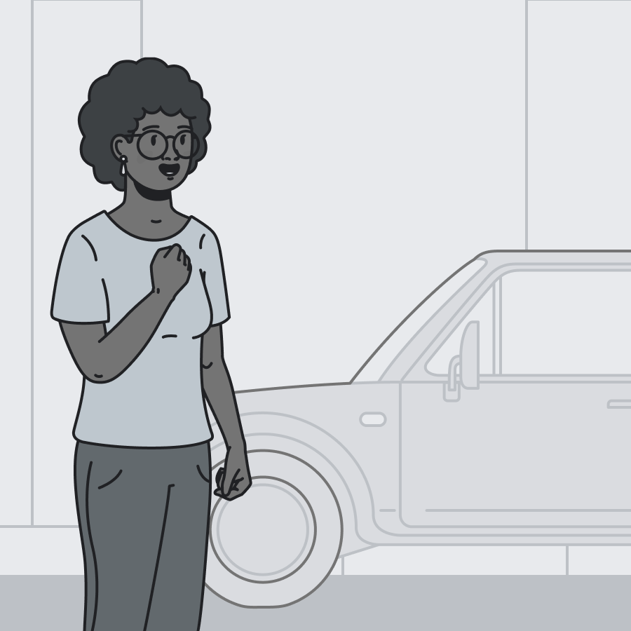 Woman standing next to car